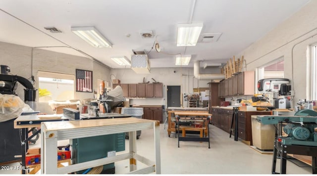 kitchen with pendant lighting and dark brown cabinetry