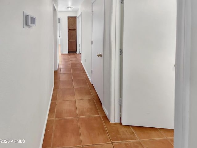 hallway featuring tile patterned flooring