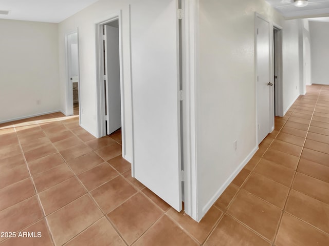 hallway with light tile patterned flooring