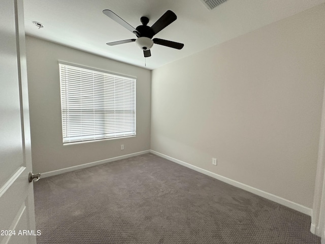 carpeted empty room with ceiling fan