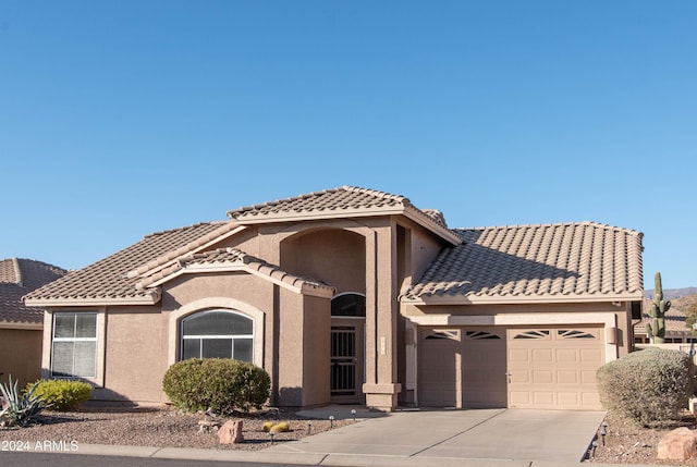 view of front of property with a garage