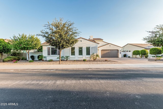 1725 E Everglade Ln, Gilbert, AZ 85298 - mediterranean / spanish-style home with a tile roof, stucco siding, driveway, and a chimney