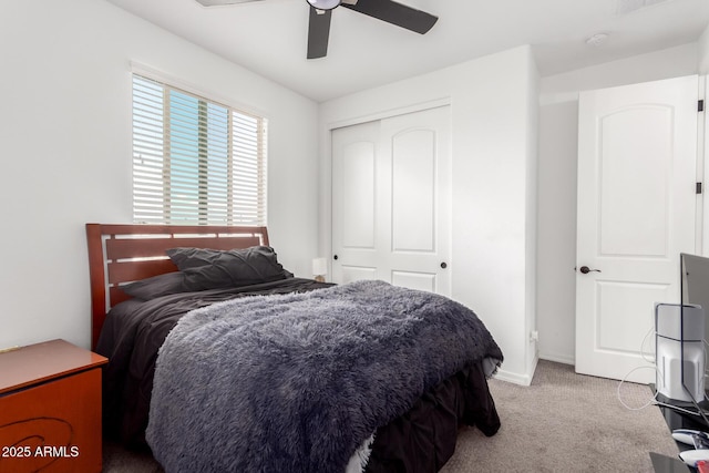bedroom with ceiling fan, a closet, visible vents, carpet floors, and baseboards