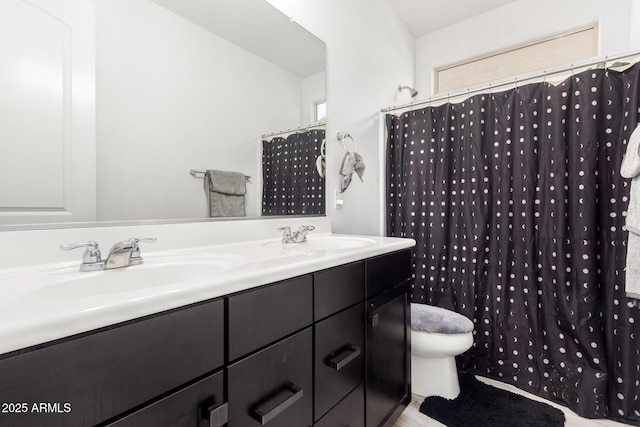 full bathroom with toilet, curtained shower, double vanity, and a sink