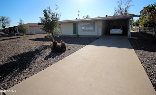 single story home with a carport