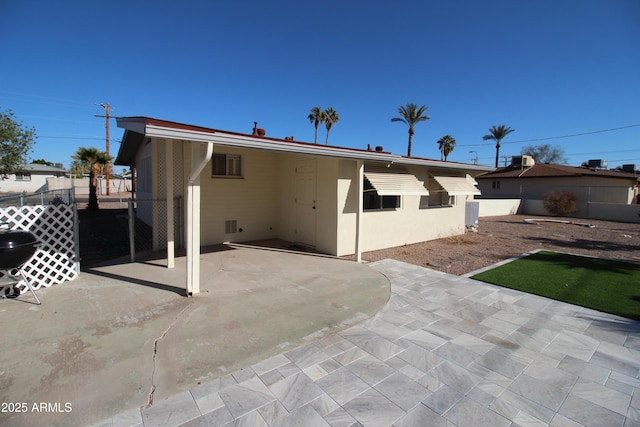 back of property featuring a patio area