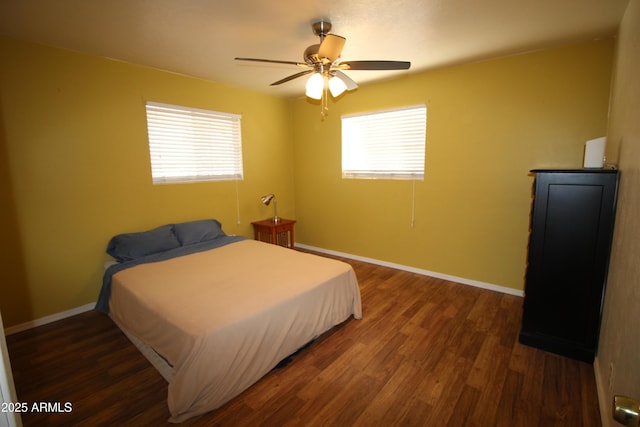 bedroom with dark wood-type flooring and ceiling fan