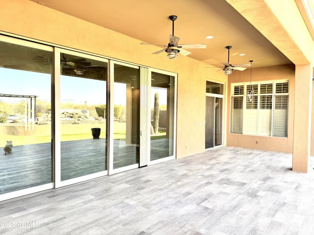 view of patio / terrace featuring ceiling fan