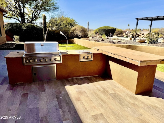 view of patio / terrace featuring grilling area and exterior kitchen