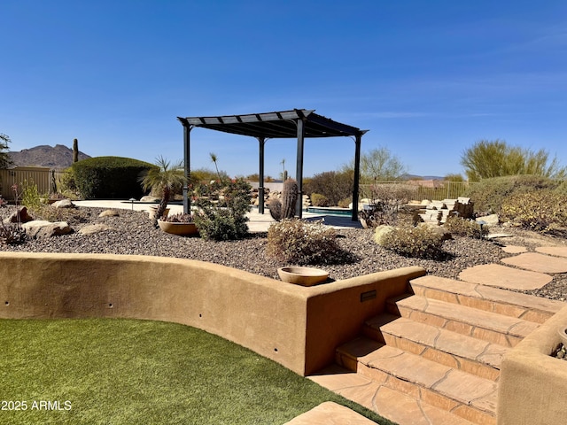 view of yard featuring a fenced in pool, fence, a patio, and a pergola