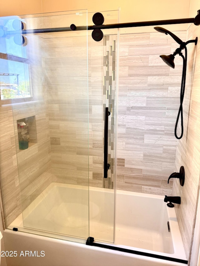 full bath with shower / bath combination with glass door