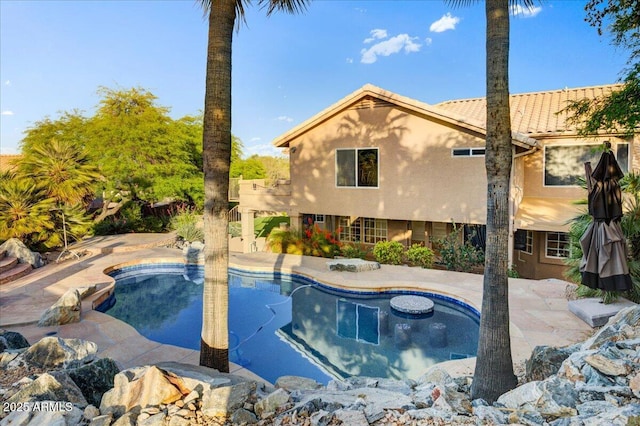 outdoor pool featuring a patio area