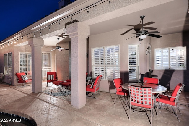 view of patio / terrace with a ceiling fan and outdoor dining space