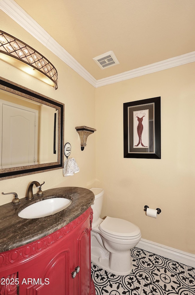 half bath with visible vents, toilet, ornamental molding, tile patterned floors, and vanity