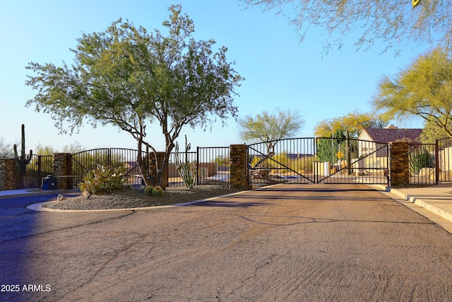 view of gate featuring fence