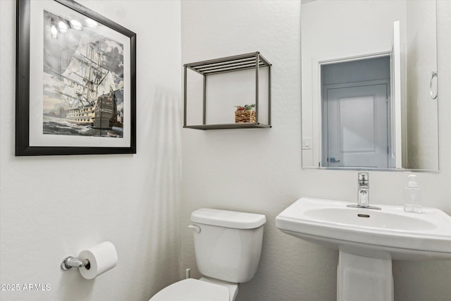 2313 E Hidalgo Ave, Phoenix, AZ 85040 - bathroom featuring toilet and a sink