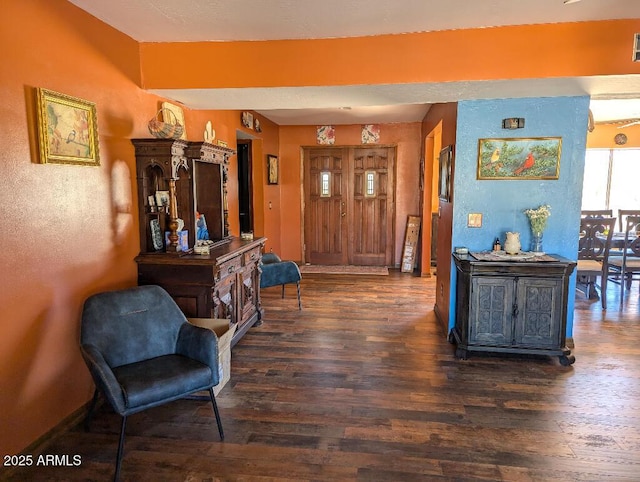 interior space with dark wood-style flooring and baseboards