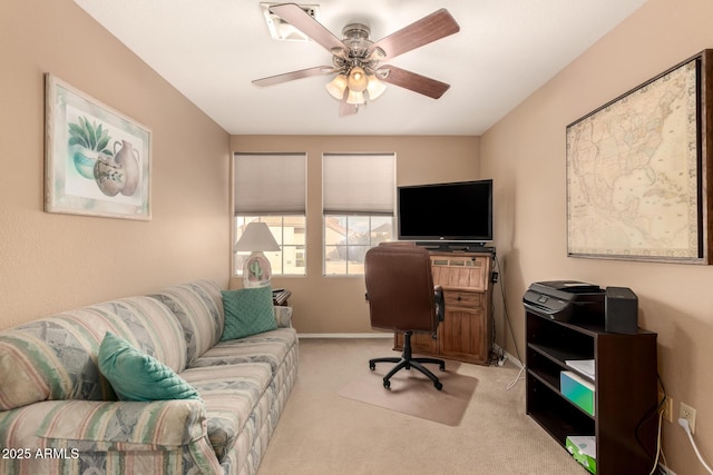 office space featuring light colored carpet and ceiling fan