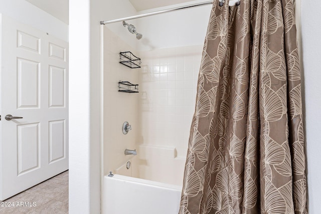 bathroom featuring tile patterned flooring and shower / bath combination with curtain