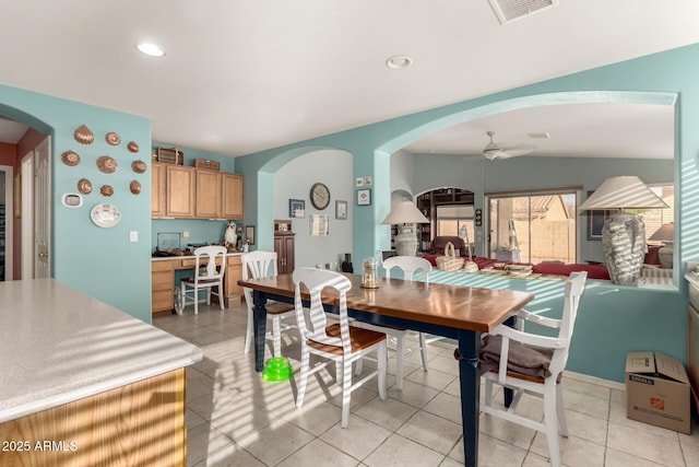 dining space featuring light tile patterned floors and ceiling fan