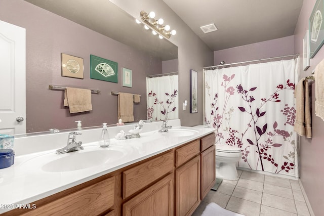 bathroom with walk in shower, tile patterned flooring, vanity, and toilet