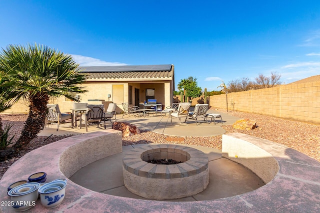 view of patio / terrace featuring an outdoor fire pit