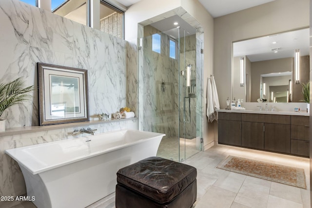 8145 E Tecolote Cir, Scottsdale, AZ 85266 - bathroom with a freestanding tub, tile walls, a marble finish shower, and vanity