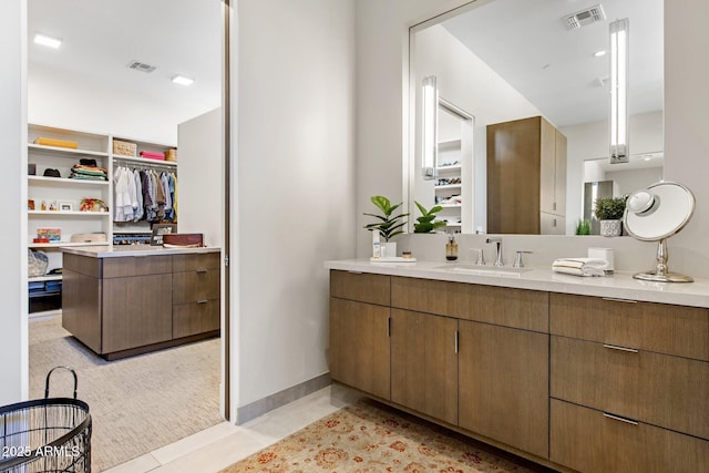 8145 E Tecolote Cir, Scottsdale, AZ 85266 - bathroom featuring visible vents, a spacious closet, and vanity