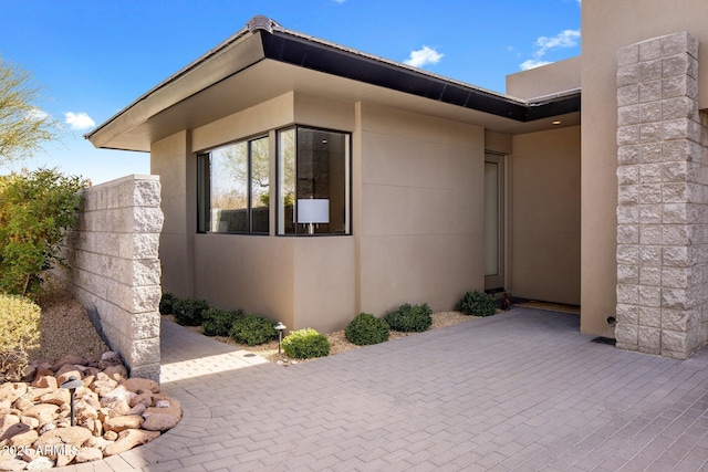 8145 E Tecolote Cir, Scottsdale, AZ 85266 - view of side of home with a patio and stucco siding