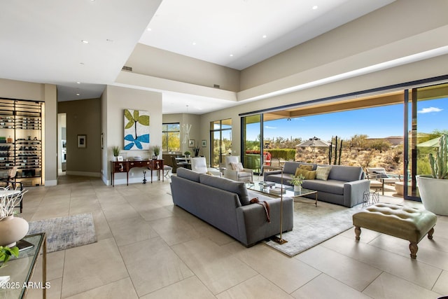 8145 E Tecolote Cir, Scottsdale, AZ 85266 - living area with light tile patterned floors, recessed lighting, visible vents, and baseboards