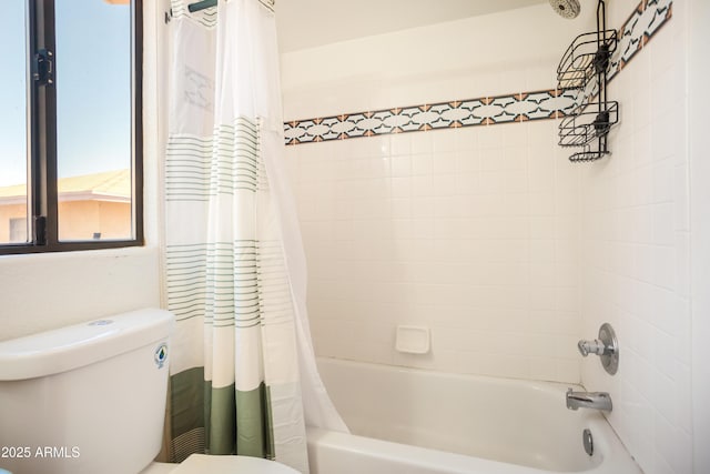 bathroom featuring toilet and shower / bathtub combination with curtain