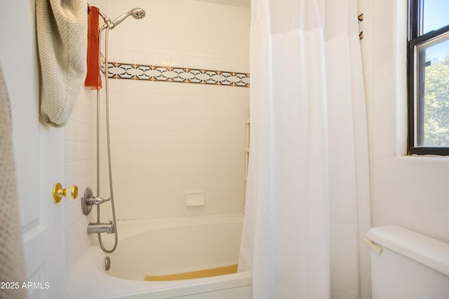 bathroom with toilet and shower / tub combo