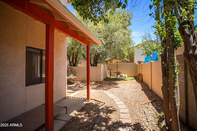 view of yard with a fenced backyard and a patio