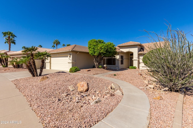 view of front of property with a garage