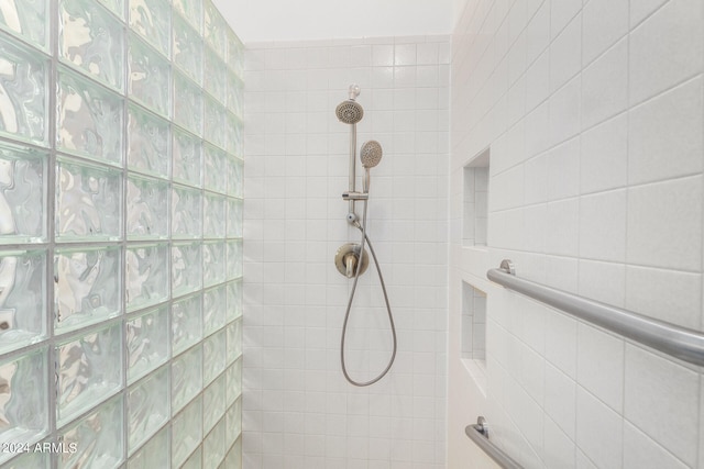 bathroom with tiled shower