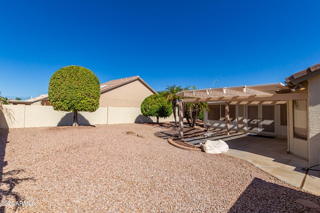 view of yard with a pergola and a patio area