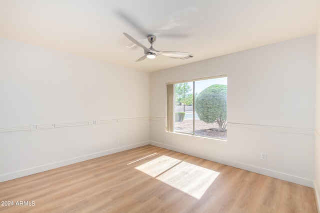 unfurnished room featuring ceiling fan and light hardwood / wood-style flooring