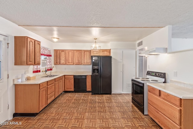 kitchen featuring sink, a textured ceiling, light parquet floors, and black appliances