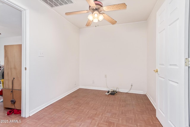 unfurnished room with ceiling fan and light parquet floors