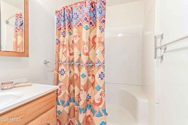 bathroom featuring vanity and walk in shower