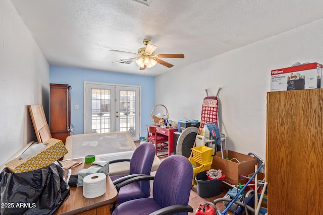 office area featuring french doors, a textured ceiling, and ceiling fan