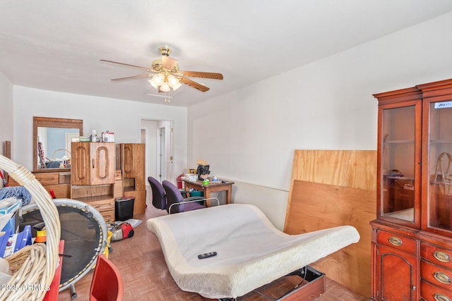 bedroom featuring ceiling fan and parquet flooring