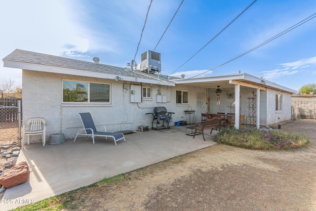 rear view of house with ceiling fan, a patio area, and central air condition unit