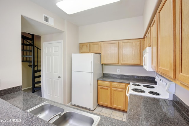 20100 N 78th Pl Unit 2105, Scottsdale, AZ 85255 - kitchen with dark countertops, a sink, light brown cabinetry, white appliances, and visible vents