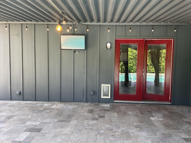 view of exterior entry featuring french doors