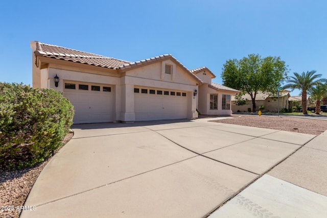 871 W Mesquite St, Gilbert, AZ 85233 - mediterranean / spanish-style home featuring an attached garage, stucco siding, concrete driveway, and a tile roof