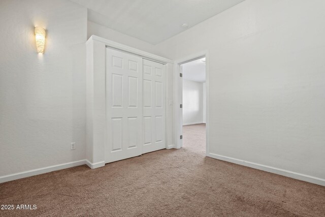 341 Dreamweaver Dr, Prescott, AZ 86301 - unfurnished bedroom with a closet, baseboards, and carpet floors