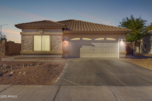 view of front of property with a garage