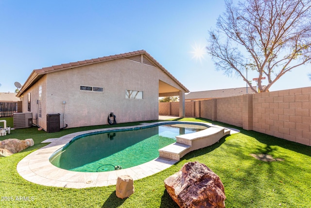 view of pool with cooling unit and a yard