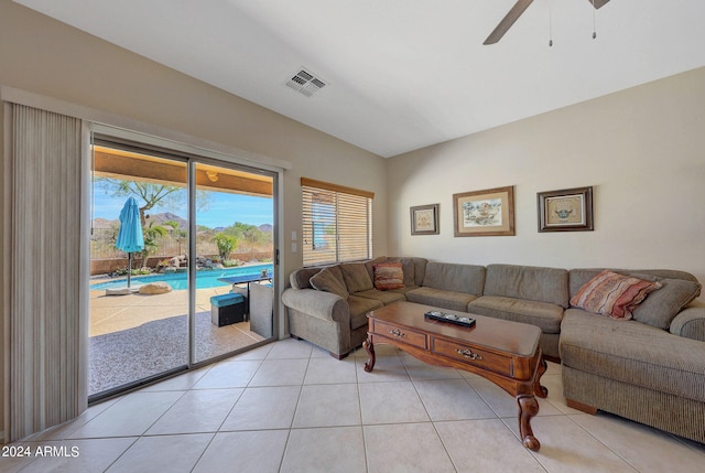 living room featuring ceiling fan and light tile patterned flooring